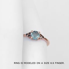 Imogene Ring with a Mossy Aquamarine and Black Diamonds in your choice of gold - Midwinter Co. Alternative Bridal Rings and Modern Fine Jewelry Topaz Sapphire Ring With Rose Cut Diamonds, Sapphire Topaz Ring With Rose Cut Diamonds, Aquamarine Diamond Ring With Vvs Clarity As Gift, Round Emerald Ring With Sapphire Accent Stones, Vvs Clarity Aquamarine Diamond Ring As Gift, Blue Topaz Diamond Ring With Gemstone Accents, Blue Topaz Diamond Ring With Rose Cut Diamonds, Aquamarine Gemstone Diamond Ring In Round Cut, Aquamarine Diamond Ring With Round Cut