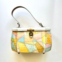 a colorful purse hanging on the wall