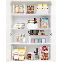 an organized pantry with white shelves filled with food and condiments, such as eggs, cheese, milk, juice, and other items