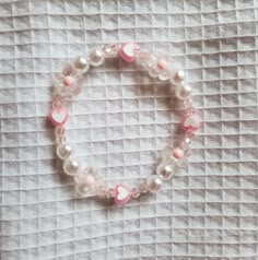 Aesthetic Pink Bracelet, Cheap Pink Pearl Bracelet For Beach, Pink Flower-shaped Beaded Charm Bracelet, Handmade Pink Crystal Dainty Bracelet, Handmade Pink Dainty Crystal Bracelet, Cute Pink Bangle Charm Bracelet, Feminine Pink Flower Bracelets, Pink Flower Pearl Bracelet Gift, Pink Beaded Flower Charm Bracelet