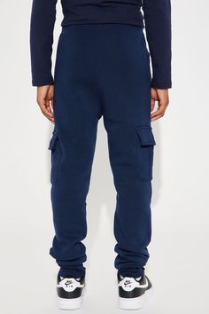 Available In Navy, Black, Heather Grey, Charcoal, Camel, And Olive. Joggers Side Pockets Solid Cargo Elastic Waist Model Wears Size 10 100% Polyester Imported | Mini Fly Vibes Jogger Pant in Navy Blue size 4 by Fashion Nova Blue Cotton Joggers For Winter, Blue Cotton Winter Joggers, Blue Cotton Pants With Ribbed Cuffs, Blue Full Length Sweatpants With Pockets, Blue Winter Bottoms With Pockets, Winter Blue Bottoms With Pockets, Navy Cotton Cargo Pants With Hip Pockets, Blue Bottoms With Ribbed Cuffs For Winter, Blue Winter Bottoms With Ribbed Cuffs