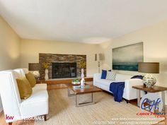 a living room filled with furniture and a fire place in the middle of the room