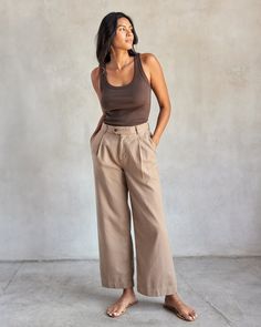 Perfectly named, this is the most effortlessly cool and versatile trouser you could own. Perfectly casual in organic cotton with flip-flops and a tank at the beach or just refined enough to get dressed up when the occasion calls for it. In a wide leg silhouette we’re swooning over, this pant is an Outerknown team favorite this fall. A high-rise single pleated pant with a relaxed wide leg for a smart and effortless look. Made with a mid-weight organic cotton weave with endless ways to dress-up or Pleated Pant, Henley Sweater, Women's Bottoms, Pleated Pants, Get Dressed, Cotton Weaving, Chestnut, At The Beach, Trousers Women