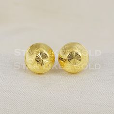 Elevate your style with these beautifully handcrafted gold earrings. Featuring a classic design and a comfortable fit, they add a refined touch to any look. Ideal for everyday wear or special occasions, they bring a subtle yet sophisticated sparkle. 18K Gold studs  Metal is Real Gold Purity is 18kt Weight is 1.73 grams approx Max Length is 1.0 centimeter approx Max width is 1.0 centimeter approx the earrings come with normal backs if you real gold screw please contact Please feel free to ask if Classic 22k Gold Earrings, Classic Yellow Gold Plated Earrings, Classic Yellow Gold Plug Earrings For Pierced Ears, Classic 22k Gold Hallmarked Earrings, Classic Hallmarked 22k Gold Earrings, Classic Yellow Gold Plug Earrings For Formal Occasion, Classic 22k Gold Earrings For Formal Occasions, Classic Gold Plated Round Clip-on Earrings, Classic Gold-plated Polished Clip-on Earrings