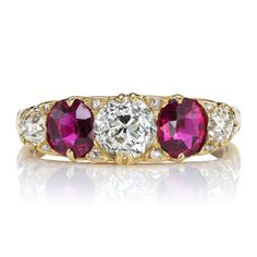 three stone diamond and ruby ring