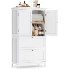 an open cabinet with towels and soaps on it's shelves in front of a white background