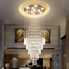 a chandelier hanging from the ceiling in a living room