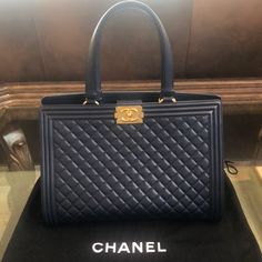 Authentic Chanel Boy Quilted Maxi Tote W/ Gold Hardware Navy Blue Color Calfskin. 14”W X 6 1/2” Depth X 9”H X 18”With Handle Height. Only Worn 3 Times Excellent Condition No Scratches Or Signs Of Wear Practically Brand New. Meticulously Cared For Statement Bag. Comes With Original Dust Bag And Authenticity Card. This Was A Limited Edition Bag One Of A Kind. Designer Everyday Luxury Bag With Handles, High-end Blue Tote Bag, Blue Shoulder Bag For Everyday Luxury, Blue Top Handle Bags For Everyday Luxury, Luxury Blue Bags For Everyday, High-end Blue Bag With Detachable Handle, High-end Blue Bag With Double Handle, High-end Blue Shoulder Bag With Top Carry Handle, High-end Blue Bags For Shopping