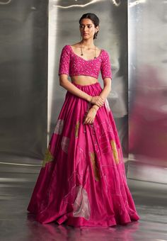 This exquisite ensemble features a hand-embroidered lehenga with intricate nakshi, dabka, and threadwork, extending elegantly across the blouse, lehenga, and dupatta. The detailed craftsmanship and shimmering gold embroidery infuse the outfit with opulence and sophistication, making it perfect for any special occasion. Pink Chanderi Dress With Intricate Embroidery, Pink Tissue Silk Set With Zari Work, Pink Tissue Silk Choli With Resham Embroidery, Pink Silk Choli With Resham Embroidery, Pink Chanderi Lehenga With Intricate Embroidery, Designer Wear Pink Tissue Silk Choli, Pink Chanderi Choli With Resham Embroidery, Pink Silk Sets With Unstitched Blouse, Pink Resham Embroidery Choli In Chanderi