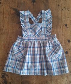 FRENCH VINTAGE 50's, lovely little pinafore dress / apron dress, blue / beige / red checkered cotton fabric, two small patch pockets, striped ribbon detailing, buttoned at the waist ( plastic button ), belt to tie. Length 19,4" Estimated size 3 years Length 20,8" Estimated size 4 years New old stock ( washed once ) In case of multiple purchases, if you want an accurate shipping estimation, please contact me ; I do always refund overcharged shipping from 1 Euro overpaid ! Thank you for your visit Cotton Plaid Ruffled Dress For Picnic, Retro Cotton Plaid Dress For Picnic, Retro Cotton School Dress, Cotton Plaid Dress With Ruffles For Picnic, Retro Gingham Plaid Cotton Dress, Retro Cotton Plaid Dress, Retro Plaid Cotton Dress, Plaid Cotton Cottagecore Dress, Retro Plaid Dresses With Ruffles