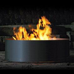 a fire pit sitting on top of a wooden floor