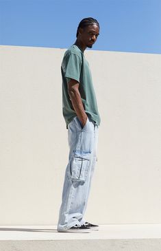 Dive into laid-back style with PacSun's Light Indigo Baggy Cargo Jeans. Crafted from light indigo denim, these jeans feature a zipfly closure, side and back pockets, and large cargo pockets with button closures and a woven PacSun tag for added flair. With a classic relaxed fit that's comfortably baggy, these jeans embody casual cool with a timeless appeal. Baggy Jeans Outfit Men, Blue Cargo Pants Outfit, Pacsun Outfits, Cargo Pants Outfit Men, Graphic Jeans, Baggy Cargo Jeans, Baggy Jeans Outfit, Pacsun Mens, Baggy Tee