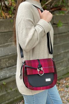 A Fall colored plaid bag with a sophisticated look. Made in Ireland with premium materials and carefully created with 200 year old looms, this bag will bring your look style and class. Has a zipper, hand strap, crossbody strap, and spacious inside for your purse essentials. Made with 100% Wool & PU Leather Length: 9", Width: 3.5", Height 8.5" Plaid Bags With Adjustable Strap, Plaid Bags With Adjustable Strap For Everyday Use, Everyday Plaid Bag With Adjustable Strap, Plaid Shoulder Bag For Everyday Use, Plaid Bag With Adjustable Strap For Daily Use, Everyday Plaid Satchel Shoulder Bag, Plaid Satchel Shoulder Bag For Travel, Plaid Satchel Bag For Everyday Use, Plaid Satchel Bag For Daily Use