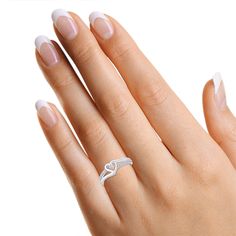 This exquisite 1/10 Carat Round White Diamond Bypass Heart Promise Ring is crafted with the finest 14k gold over sterling silver and features 0.10 cttw of shimmering diamonds of I-J Color and I2-I3 clarity. Perfectly capturing the spirit of love, this luxury ring promises a lifetime of commitment and elegance. 0.10 Carat White Natural Diamond Stone Setting : Prong Setting Model No : CSR-140120208 Heart Promise Rings, Luxury Ring, Rose Ring, Luxury Rings, Stone Setting, Diamond Clarity, Diamond Stone, Promise Ring, Stone Settings