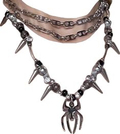 Edgy Adjustable Necklaces For Streetwear, Edgy Adjustable Necklace For Streetwear, Metal Choker With Adjustable Chain For Concerts, Edgy Halloween Streetwear Necklaces, Edgy Halloween Streetwear Necklace, Punk Style Silver Stainless Steel Necklaces, Punk Style Silver Stainless Steel Necklace, Punk Style Adjustable Chain Necklace For Streetwear, Punk Style Necklace With Adjustable Chain For Streetwear