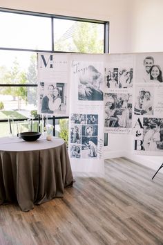 a table with a cloth draped over it and pictures on the wall in front of it