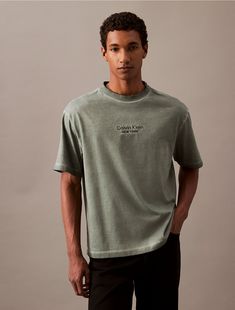 Crafted from 100% cotton, this t-shirt is soft and breathable, perfect for everyday wear. Styled with short sleeves and a crewneck. Cut in a relaxed fit and features a logo graphic at the front.  Material: 100% Cotton. Logo Graphic, A Logo, Calvin Klein, Everyday Wear, Short Sleeves, Dye, Relaxed Fit, Crew Neck, ? Logo