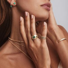 14k gold kundalini coil ring with 0.38 total carat weight emeralds. Dainty Emerald Open Ring Jewelry, 14k Gold Open Emerald Ring, Fine Jewelry, 14k Gold Emerald Open Ring, 14k Gold Open Emerald Ring, Stackable Open Ring With Emerald, Gold Stackable Open Rings With Emerald, Dainty Yellow Gold Emerald Open Ring, Elegant Green Open Band Jewelry, Yellow Gold Emerald Open Ring