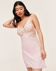 Our lovely and romantic Raquel slip dress is unlined, has adjustable ties in the back, and is made from sheer georgette and lace in a beautiful bright white. It's the perfect lingerie to add some romance to your night. (Available in sizes XS-XL.) Feminine Backless Dress With Lace Trim, Fitted Slip Dress With Delicate Straps For Daywear, Feminine Summer Lace Dress With Lace Back, Feminine Camisole With Sweetheart Neckline For Spring, Camisole Sleep Dress With Delicate Lace, Elegant Backless Slip Dress With Lace Bodice, Feminine Sweetheart Neckline Camisole For Spring, Elegant Lace Bodice Backless Slip Dress, Feminine Spring Camisole With Sweetheart Neckline