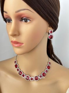 Ruby CZ diamond Necklace,Indian Pakistani wedding Jewelry,Mother of the Bride,Crystal Necklace, Bridesmaid, Gift for her Gorgeous Ruby CZ Set in aaa quality CZ stones. This American Diamond Necklace Set comes with a pair of earrings. Necklace length 16 inches and shortened to 15 inches  Earrings Length approx 1 inch Regular size and adjustable Arrives in a gift box. Highest quality and craftsmanship Ready to ship from California, United States and delivery in 3-5 days in US Please let me know if you have any questions. Thank you so much for visiting my shop. Color, shades, and texture displayed may slightly vary from the actual product due to digital image limitations. We request you to consider these minor variations. Please expect the possibility of some slight imperfections when buying Elegant Crystal Rhinestone Necklace For Valentine's Day, Crystal Jewelry For Wedding And Valentine's Day, Dazzling Jewelry For Wedding On Valentine's Day, Dazzling Jewelry For Valentine's Day Wedding, Wedding Jewelry Sets For Valentine's Day, Dazzling Wedding Jewelry For Valentine's Day, Elegant Rhinestone Necklace For Valentine's Day Anniversary, Silver Jewelry Sets For Wedding On Valentine's Day, Diamond White Jewelry For Valentine's Day Wedding