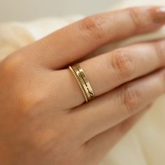 Personalize a message onto our Classic and bold, this band ring shines from all angles. Made from high quality materials that are perfect for everyday wear! Gold Filled Hypoallergenic, lead and nickel free Band Width 3.5mm Customize your message, maximum of 60 characters (including spaces). In photo: "Life is tough my darling, but so are you" - Maya Angelou #R015-G Minimalist Adjustable Promise Bands, Adjustable Stackable Bands For Promise, Adjustable Engraved Ring Tarnish Resistant For Everyday, Adjustable Tarnish-resistant Engraved Ring For Everyday, Gift Double Band Stackable Bands, Gift Stackable Double Band, Life Is Tough, Maya Angelou, Band Ring