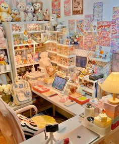 a room filled with lots of stuffed animals and other stuff on the wall behind a desk