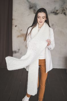 "SIZE: One size - length 78\", width 14\" (~200 cm x  35 cm) Color: Off white (on the picture) and also you can choose from many color options as well Please note that there might be some colors discrepancies due to the different monitor settings. Big fluffy scarf is at the same time very light weight. It's weight is 250 grams only. So you will not actually feel it on your shoulders. A scarf will warm you up in cold indoor environments, during the fall it will be stylish addition to a leather jacket and will protect you if you ever forget your hat. It is very stylish and comfortable accessories.  DETAILS 50% mohair wool, 20% wool, 30% acrylic Model is 5,6\" (175 cm)  HANDMADE. All my knitwear are hand made in Lithuania. Each piece is unique and I take a lot of time and care to create these White Knitted Scarf For Fall, Cozy White Winter Scarves, Cozy Knitted White Scarves, Knit Neck Warmer, Fluffy Scarf, Thick Scarf, Big Knits, Winter Shawl, Wool Winter