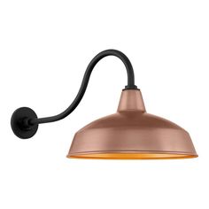 an industrial style wall light with a metal shade on the side and a black arm