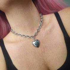 Stunning gothic/punk style chunky broken heart choker necklace in silver 💔  Chunky yet lightweight and comfortable to wear this necklace goes well with any outfit! This necklace is made of 100% stainless Steel so is water resistant and won't tarnish or discolour! Available in various sizes ( necklace shown in photographs measures 15 inches) Width of chain: 12mm Heart pendant measures: 29x26mm Please don't hesitate to contact me with any queries or suggestions 😊  Comes gift wrapped 🖤 Grunge Gift Ideas, Heart Pendant Necklace Silver, Punk Necklace, Emo Grunge, Heart Choker Necklace, Tiffany Necklace, Pendant Necklace Silver, Heart Choker, Gothic Punk