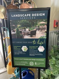 a sign advertising landscaping services in front of some potted plants and other outdoor furniture