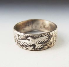 Here is a photoshopped image of what the hawk ring will approximately look like . It's sterling overlayed with fine silver. The patina brings out the lovely painterly quality. These are custom made to your size and take about 2 weeks. Since I make each one by hand, no two are exactly alike. I can also work with you to create a design of your own. Contact me so we can discuss your ideas further. If you are unsure of your size, you can purchase this ring sizer. It is adjustable, tells you the size Unique Hand Cast Sterling Silver Engraved Ring, Heirloom Sterling Silver Hand Cast Jewelry, Heirloom Hand Cast Sterling Silver Jewelry, Sterling Silver Carved Engraved Ring Collectible, Collectible Carved Sterling Silver Engraved Ring, Collectible Sterling Silver Engraved Ring, Sterling Silver Engraved Collectible Ring, Nature-inspired Carved Sterling Silver Jewelry, Carved Sterling Silver Heirloom Jewelry