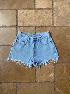 "Vintage 90s Light Wash Distressed Shorts by GAP 29/30W, tagged a W30. Made in USA. 100% cotton. Button fly. It has distressing and has light marks on the back side, shown in the last two slides. Shown held on a XS, 5'3\". Measurements: Waist: 14.5\" Waist (taut): 15\" Rise: 11\" Hips: 19.5\"" Cheap Vintage Dark Wash Shorts, 90s Distressed Bottoms With Relaxed Fit, 90s Style Distressed Relaxed Fit Bottoms, 90s Distressed Relaxed Fit Bottoms, 90s Style Relaxed Fit Cotton Shorts, 90s High-waist Cotton Jean Shorts, Retro Ripped Light Wash Bottoms, Ripped Light Wash Cotton Shorts, Light Wash Ripped Cotton Shorts