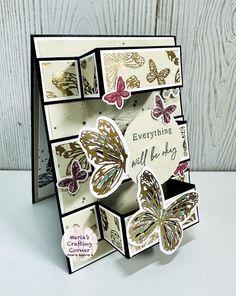 a close up of a greeting card with butterflies on the front and back of it