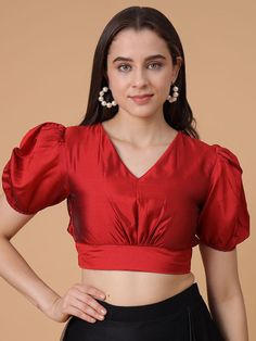 *This stunning deep red satin blouse combines elegance with modern flair * Perfect for any occasion *The puffed short sleeves and flattering V-neckline add a touch of sophistication * While the fitted waist and pleated details create a chic, tailored look *Made from luxurious Satin Silk   * This blouse is designed for comfort and style, making it an ideal choice for festive events, weddings, or parties * Pair it with sarees, skirts, or lehengas for a timeless, versatile look that stands out. Elegant Short Sleeve Blouse With Gathered Sleeves, Puffed Blouse Designs, Satin Blouse With Gathered Sleeves, Fitted Satin Blouse With Puff Sleeves, Elegant Formal Blouse With Short Sleeves, Fitted Satin Puff Sleeve Blouse, Elegant Short Sleeve Formal Blouse Piece, Elegant Formal Short Sleeve Blouse Piece, Elegant Formal Short Sleeve Blouse