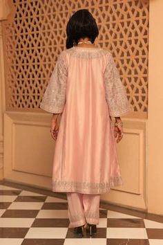 Rose pink panelled chauga kurta with embroidery work using kashmiri tilla, mirror work in floral motifs pattern. Paired with a salwar with embroidered hem. - Aza Fashions Pink Kurta For Eid Reception, Elegant Pink Sets For Transitional Season, Pink Cotton Silk Set For Reception, Pink Dabka Kurta For Reception, Elegant Pink Palazzo Set In Cotton Silk, Elegant Pink Cotton Silk Palazzo Set, Pink Resham Embroidered Art Silk Kurta, Elegant Pink Cotton Silk Sharara, Elegant Pink Palazzo Set With Cutdana