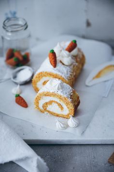 there is a pastry with cream and carrots on it