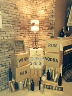 wine boxes stacked on top of each other in front of a brick wall and fireplace