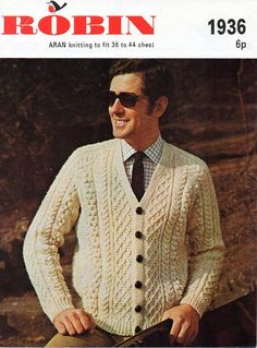 a man in a sweater and tie is smiling