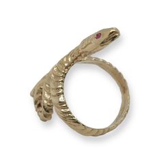 Slither is Designed and handcrafted by Heirloom Pavé. This Serpent ring is crafted in 14k yellow gold. The eyes hold approx. .03ct Red Rubies. This Snake sleekly wraps around the whole finger and continues the designed texture all the way around. It is a nice and weighty ring, at 7.27 grams of 14K yellow gold. The long shape really elongated the fingers. Size 7. This ring has been inspected for authenticity by a Certified Gemologist & Master Jeweler. FOLLOW US TO SEE MORE PHOTOS OF OUR JEWELRY O Luxury 14k Gold Snake-shaped Ring, Yellow Gold Snake-shaped 14k Gold Rings, Unique Yellow Gold Snake Ring, 14k Gold Snake-shaped Ring, Adjustable Yellow Gold Snake Ring, Unique Yellow Gold Snake-shaped Ring, Adjustable Unique Yellow Gold Snake Ring, Luxury 14k Gold Snake Ring, 14k Gold Snake Ring