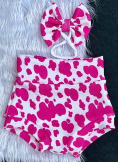 Every baby girl needs a pair of pink cow print bummies. This high fashion pink cow bummie and bow set is so soft to the touch, comfy and look great. There my be slight differences in size or color of the cow spots due to different fabric suppliers but the overall look should not change. Please allow 7-14 days for completion of your order but should you need it sooner just message me. Custom orders are welcomed. Please supervise small children while wearing our items due to some items have small parts that could pose a chocking hazard. Western Baby Clothes, Baby Girl Sign, Pink Cow Print, Cow Birthday Parties, Rodeo Birthday, Cow Spots, Cow Birthday, Western Babies, Baby Girl Pink