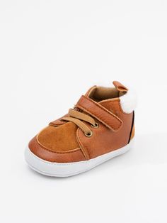 Stay stylish and warm through the crisp fall days with these High Top Velcro Sneakers! The soft faux fur makes them extra cozy, while the velcro makes them adjustable and easy to take on and off - perfect for little feet. Plus, these trendy shoes will make your babies look chic no matter the weather! Fits true to size. Velcro closure. Elastic laces. Soft sole Import. **Afterpay and Sezzle Purchase Requires $35 Minimum Order. Brown Winter Booties With Soft Sole, Winter Brown Booties With Soft Sole, Velcro Sneakers, Fall Days, Romper Outfit, Boy Accessories, Baby Boy Shoes, Bubble Romper, Elastic Laces