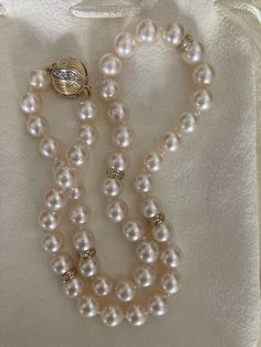 Gorgeous vintage Akoya pearl necklace, 17.5" with diamond spacers, 13 mm diamond clasp all in 14k. The pearls are 8-8.5 mm and display high luster and lovely ivory pink coloring. Well matched with smooth skins. Diamonds on both sides of round clasp. Beautiful vintage pearl diamond necklace. Comes in lovely cream suede drawstring pouch. Classic Pearl Necklace With Diamond Accents For Anniversary, Formal Vintage Akoya Pearl Necklace, Classic Pearl Necklace With Diamond Accents, Classic Diamond Pearl Bracelet For Formal Occasions, Vintage Akoya Pearl Necklace For Formal Occasions, Classic Pearl Necklace With Diamond Accents For Wedding, Classic Wedding Pearl Necklace With Diamond Accents, Vintage Akoya Pearl Drop Necklace, Vintage Single Strand Akoya Pearl Jewelry