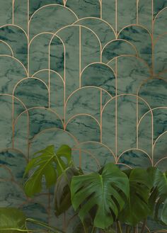 a green and gold wallpaper with plants on it in front of a marble background