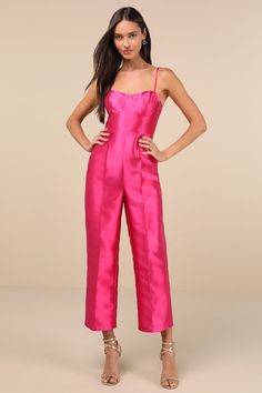 Get ready to become an overnight style icon in the Lulus Contemporary Pose Hot Pink Taffeta Bustier Sleeveless Jumpsuit! Crisp woven taffeta, with a subtle sheen throughout, shapes adjustable spaghetti straps that support a bustier-style bodice with seamed cups and a high, fitted waist. Straight legs boast seamed detailing as they fall to ankle-length hems. Hidden zipper/clasp at back. Fit: This garment fits true to size. Length: Ankle length. Size medium measures 47.5" from adjustable straps to Bustier Jumpsuit, Hot Pink Jumpsuits, Jumpsuit For Wedding Guest, Pink Jumpsuit, Adhesive Bra, Sleeveless Jumpsuits, Strapless Bra, Style Icon, Hidden Zipper