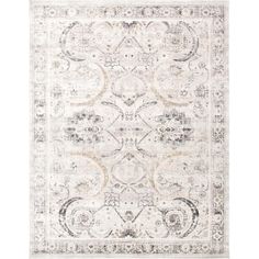 an area rug with white and grey colors on the floor, including a large medallion design