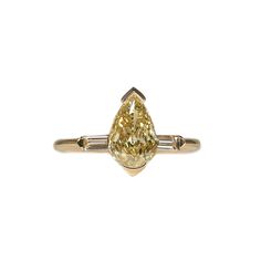 Our Ophelia Faint Yellow Diamond Three Stone Deco Ring is a striking alternative to the traditional white diamond engagement ring. The sparkling, fancy yellow center stone shimmers from its unique setting of shimmering open bezel 18K gold. It is surrounded on each side by baguette cut white diamonds to create an eye-ca Luxury Yellow Pear-shaped Ring, Elegant Yellow Pear-shaped Diamond Ring, Yellow Diamond Pear-shaped Ring, Luxury Yellow Sapphire Ring With Center Stone, Yellow Pear-shaped Diamond Rings, Yellow Gold Pear-shaped Diamond Ring With Prong Setting, Yellow Gold Diamond Ring With Prong Setting, Pear-shaped, Pear-shaped Yellow Diamond Ring For Wedding, Elegant Yellow Diamond Ring With Brilliant Cut