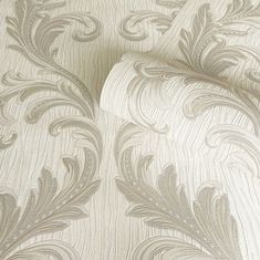 an upholstered wallpaper with white and silver designs on it's sides