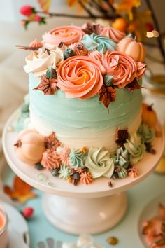 there is a multi layer cake with flowers on the top and frosting on the bottom