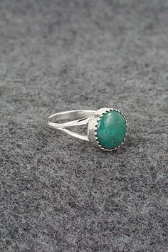 This turquoise and sterling silver ring was made by Navajo silversmith Robert Martinez. The inside of the band is stamped sterling.Size: 5.75Length: 3/8"Width: 3/8"Free shipping on all orders! We ship with USPS and always include tracking. All orders ship within a day of payment.Returns are accepted up to 30 days after you receive your order. Just send us a message. Our shop offers cash back or store credit. The item must be returned in new condition. Southwestern Sterling Silver Turquoise Ring, Untreated Turquoise Sterling Silver Ring, Southwestern Style Stamped 925 Turquoise Ring, Southwestern Style Turquoise Ring Stamped 925, Untreated Silver Turquoise Ring, Turquoise Emerald Ring Sterling Silver 925, Robert Martinez, Bear Carving, Pearl Chain