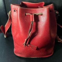 Prada Vintage Leather Bucket Shoulder Bag. Preowned Item. The Bag Has Some Scratches On The Leather. Please See Pictures For Description.The Shoulder Straps Is Coming Apart On The Top. Measures Approximately 9”X12”. The Number On The Inside Name Plate 185 Ar 925. Number 51 Is On The Tag Inside The Pocket. Designer Red Bucket Bag For Formal Occasions, Red Formal Bucket Bag With Adjustable Strap, Formal Red Bucket Bag With Adjustable Strap, Classic Red Bucket Bag For Travel, Formal Red Rectangular Bucket Bag, Red Leather Bucket Bag, Classic Red Leather Bucket Bag, Red Rectangular Formal Bucket Bag, Red Leather Bucket Shape Bags